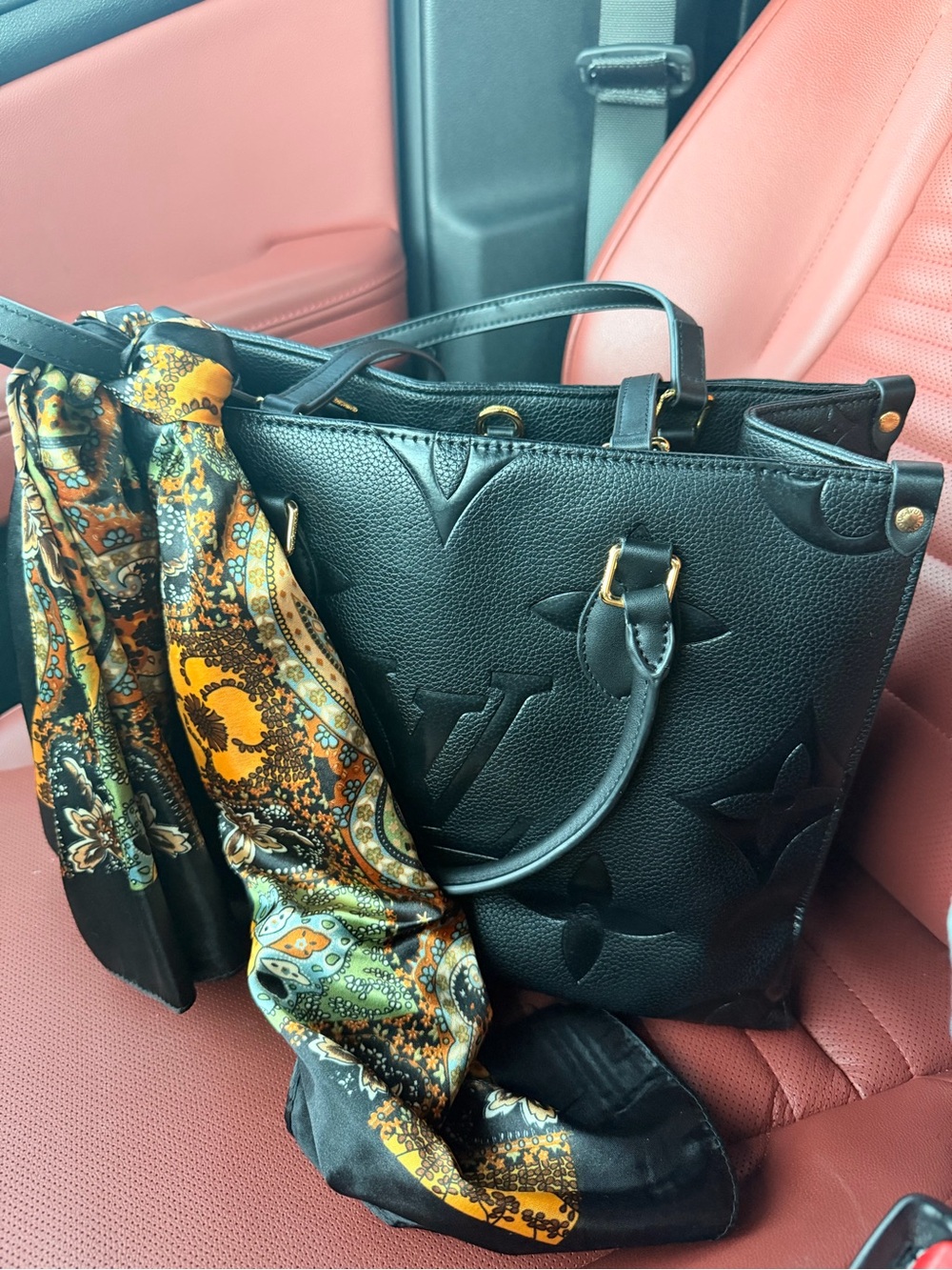 Black Embossed Leather Tote Bag with Vibrant Paisley Scarf Accent